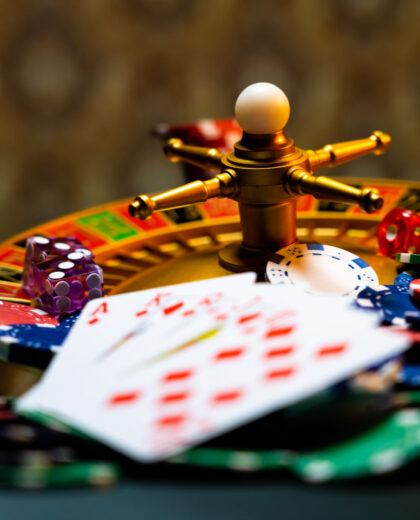 Casino set with Roulette, cards, dice and chips on BlackJack mat
